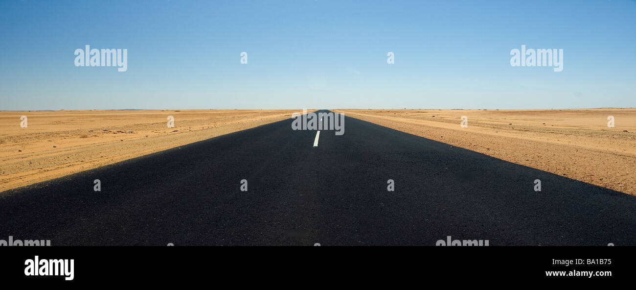 Desert road cutting through the Nubian Desert road Stock Photo
