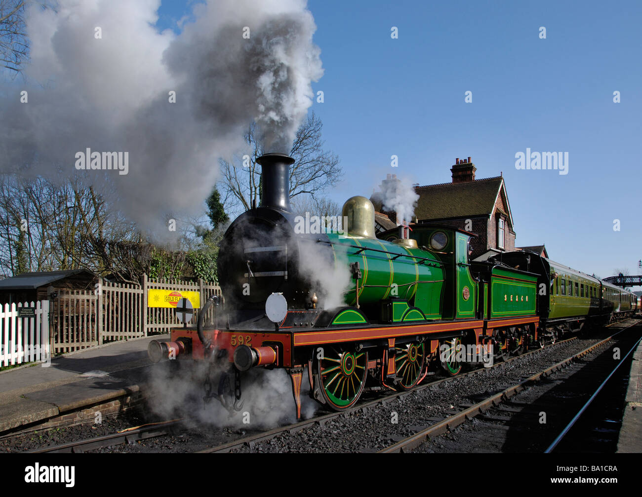 Wainwright C Class Locomotive No.592 pulls out of Sheffield Park Station on the Bluebell Railway in Sussex. Stock Photo