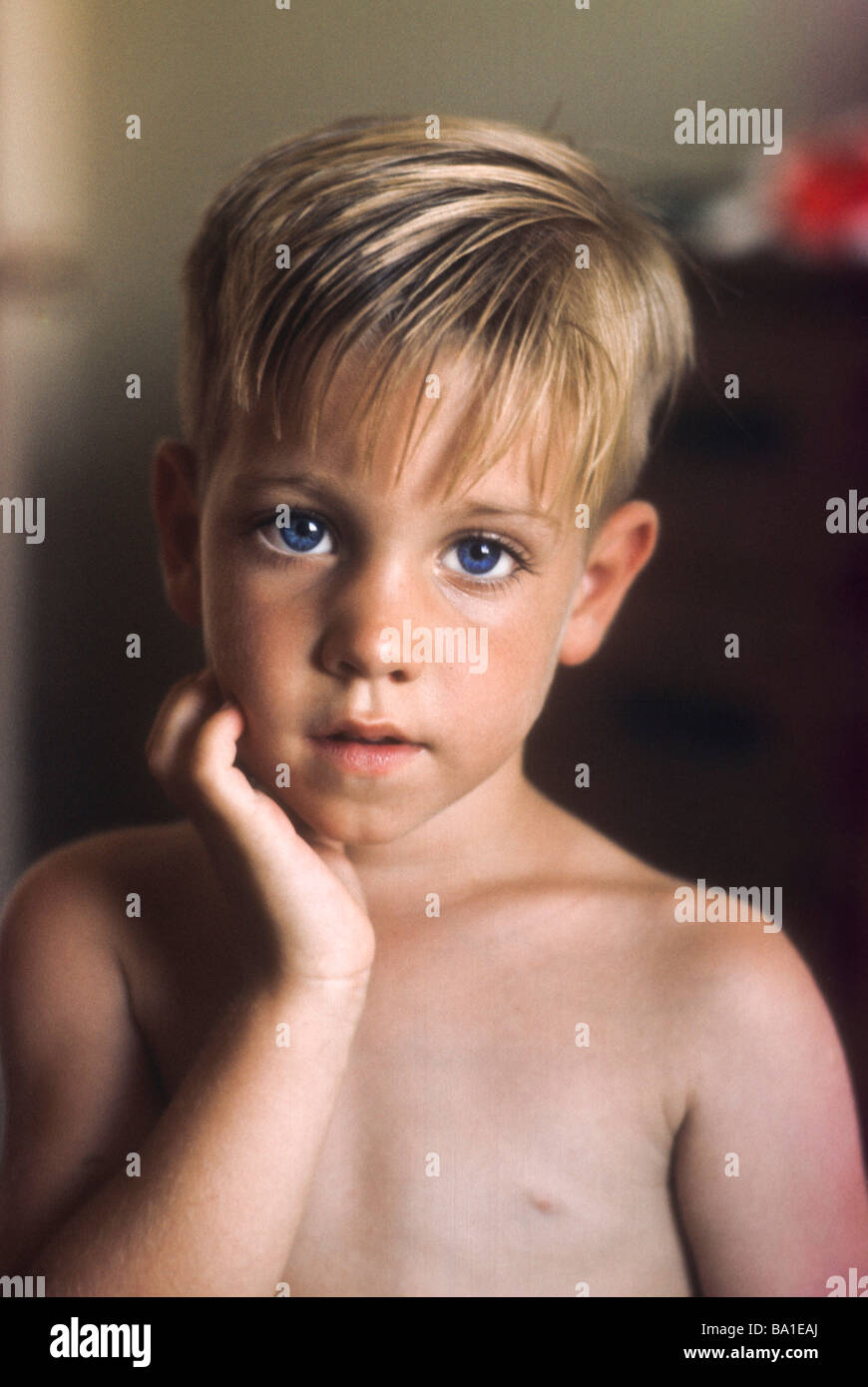 Young Boy Intent Serious Look Direct Blue Eye Blond Hair Shirtless