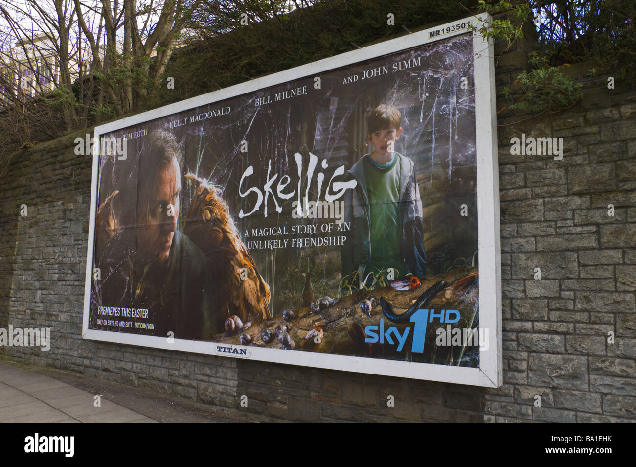 Titan advertising billboard for film Skellig on Sky 1HD on stone wall in Cardiff South Wales UK Stock Photo