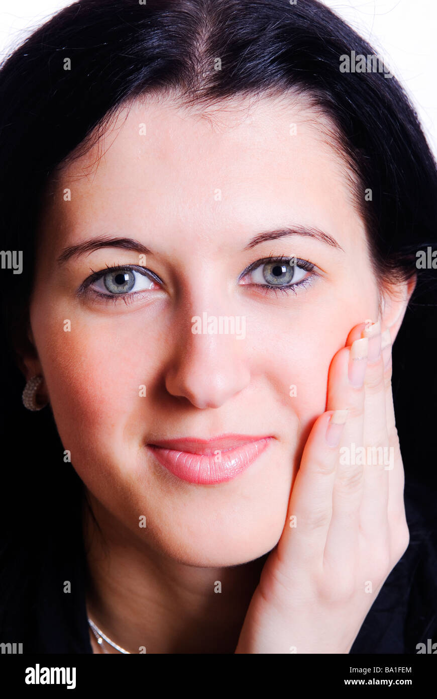 beautiful young woman hand touching face Stock Photo - Alamy