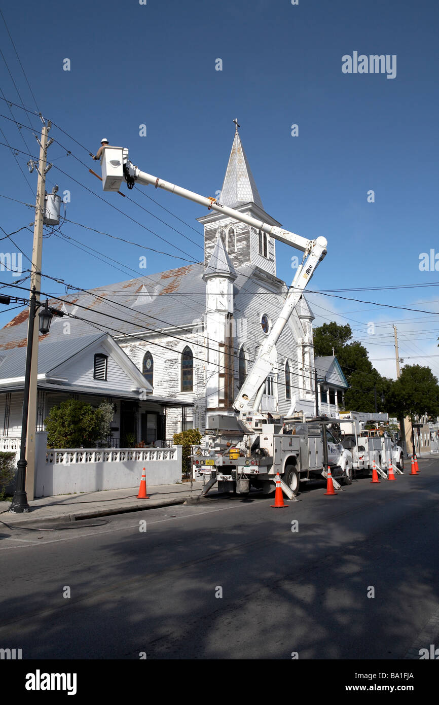 Electric Company worker repairing electric cables Key West Florida USA