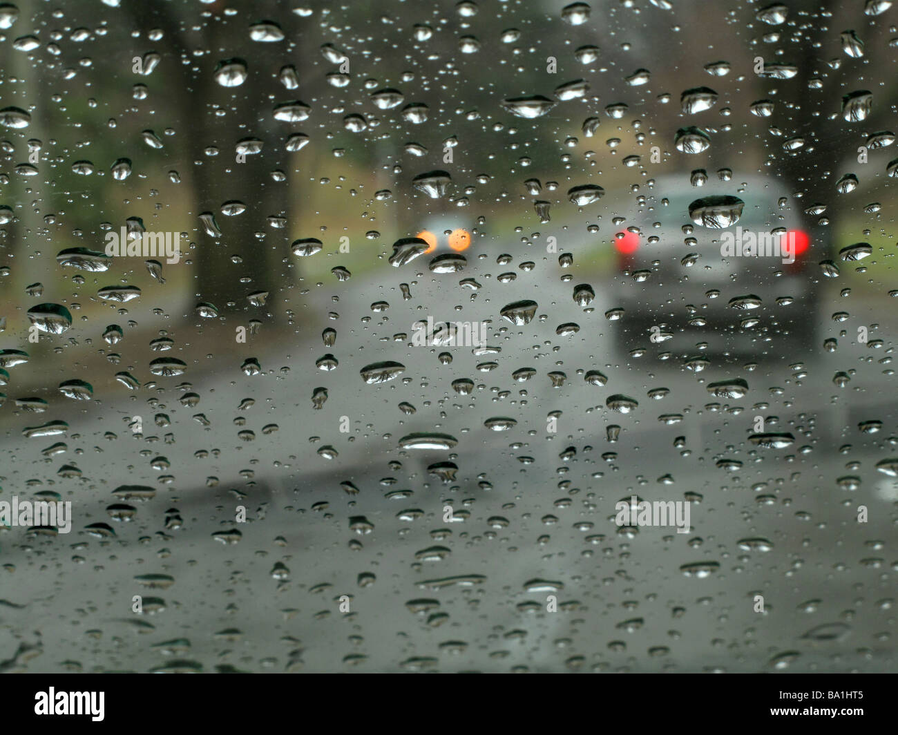 Looking through wet windshield of car. Stock Photo