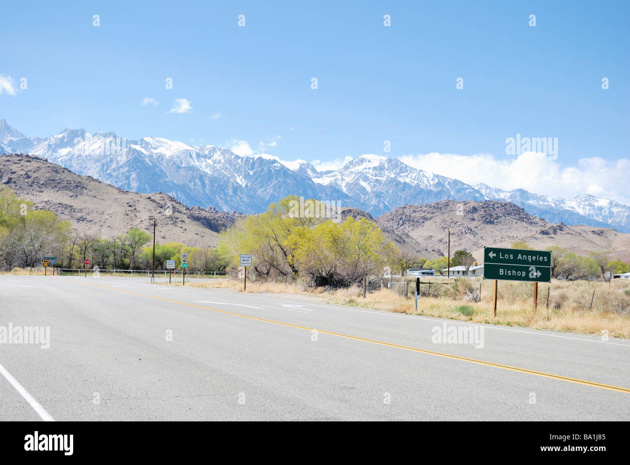 Approaching US 395 north of Owens Lake near Lone Pine, CA, Alabama Hills and the eastern slope of the Sierra Nevada background. Stock Photo