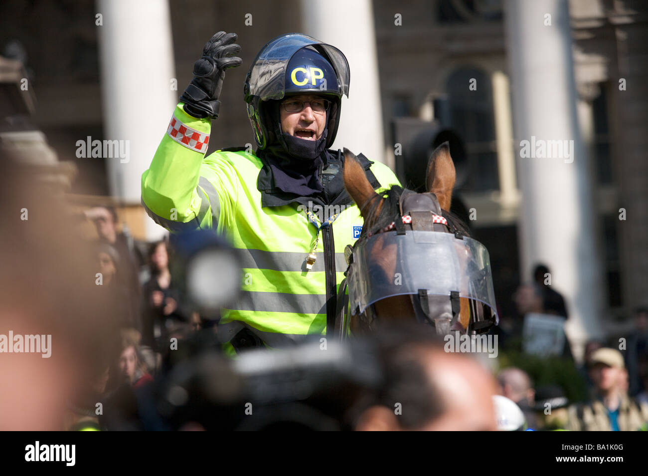 Mounted policeman moving G20 protestors from front of The Bank of England, London. Stock Photo