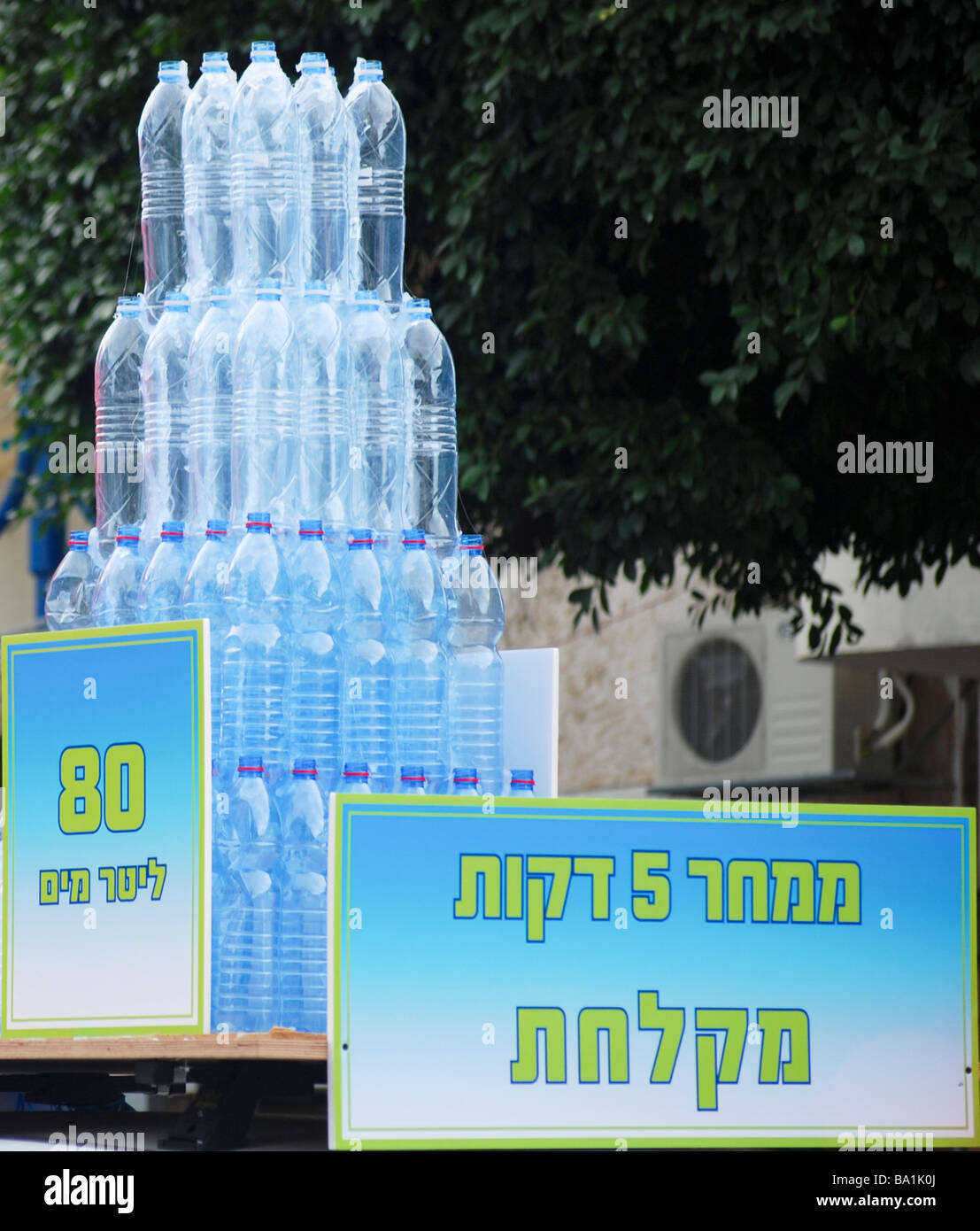 Save water display showing mineral water bottles containing 80 litres