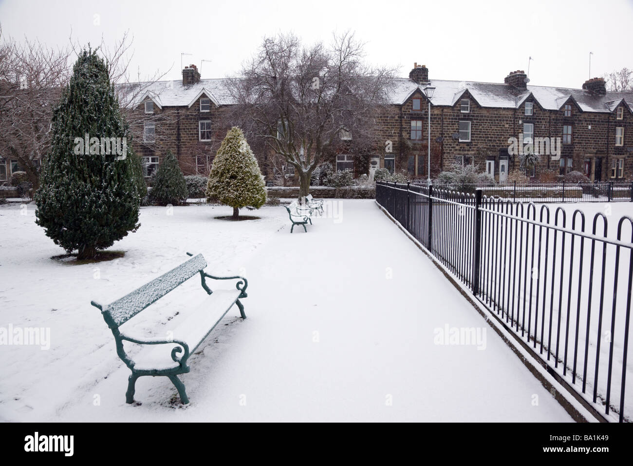 Snowfall transforms the park in Otley West Yorkshire, England Stock Photo