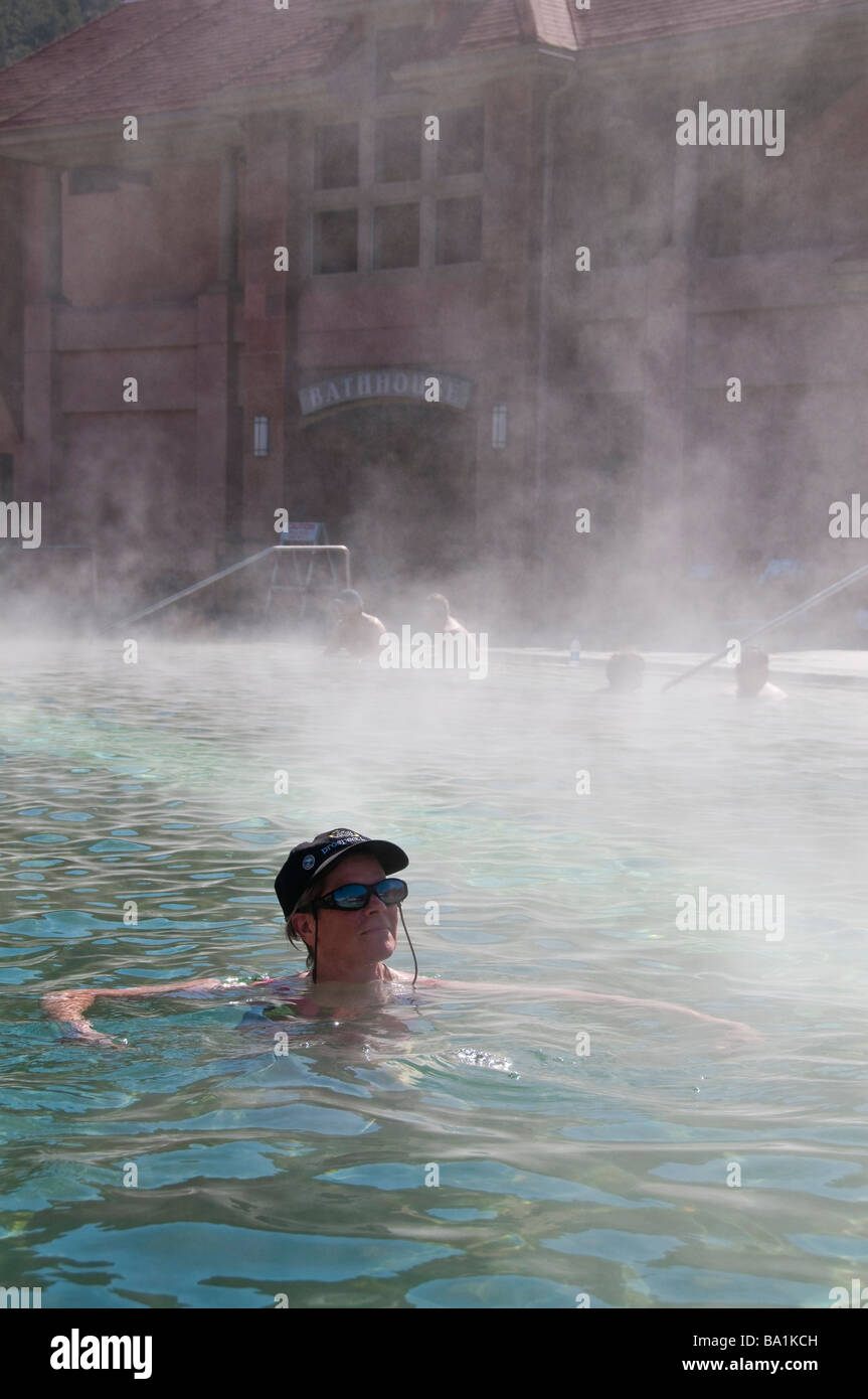 Woman soaks in the steamy therapy pool, Glenwood Hot Springs, Glenwood Springs, Colorado. Stock Photo