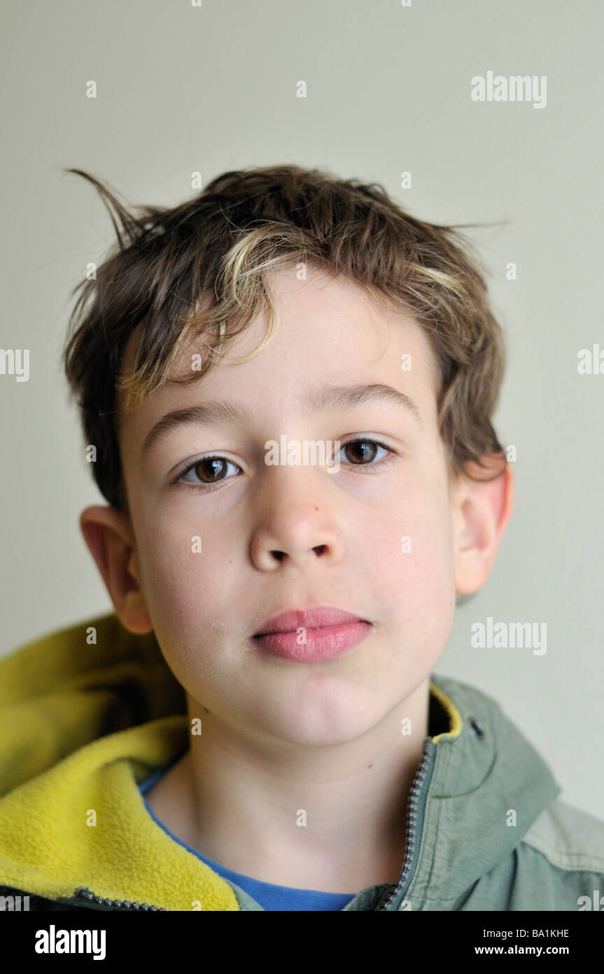 Portrait of a nine year old boy looking straight in the camera Stock Photo