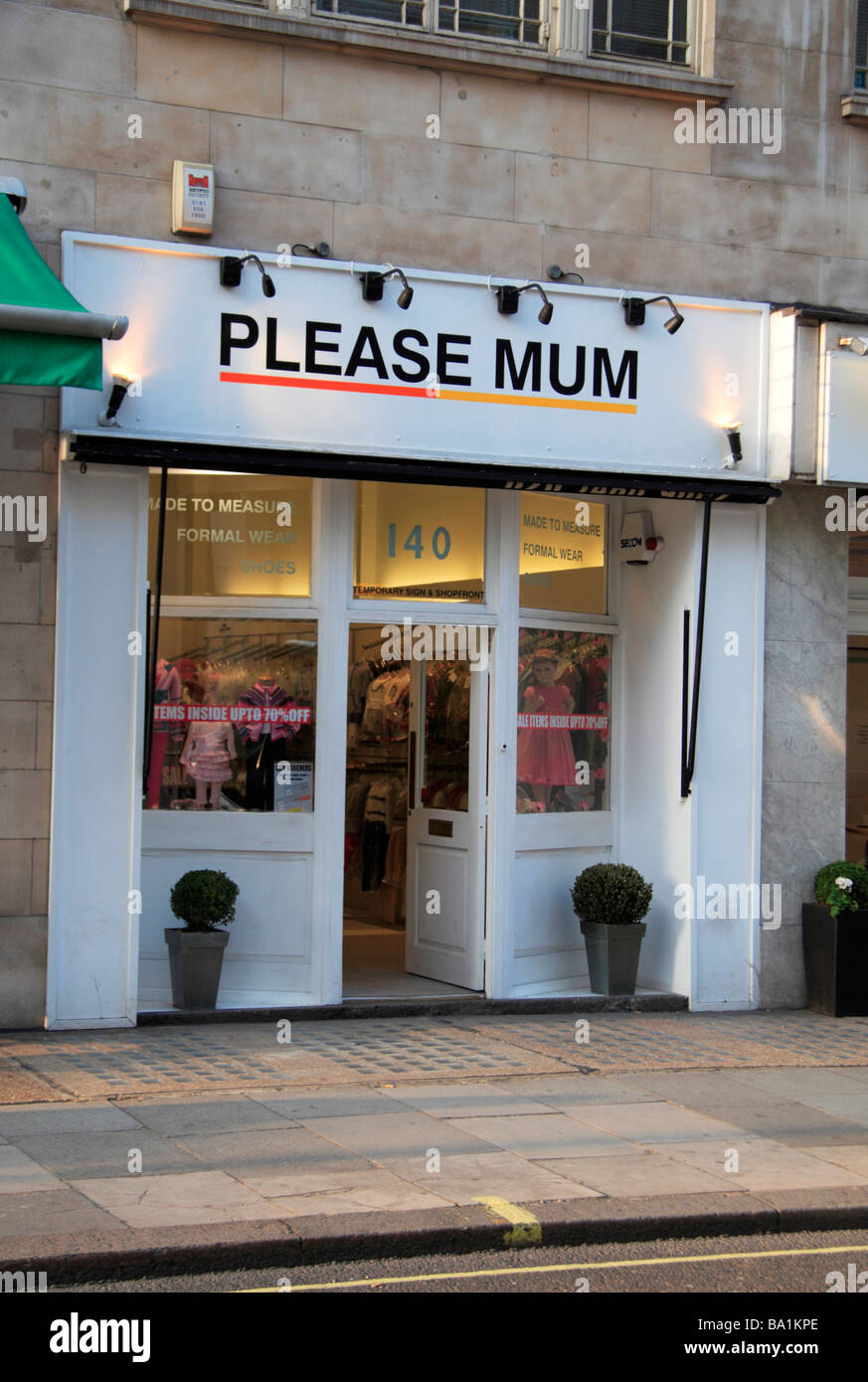 The shop front of the 'Please Mum' children's fashion and clothing store on Orchard Street London, UK. Stock Photo