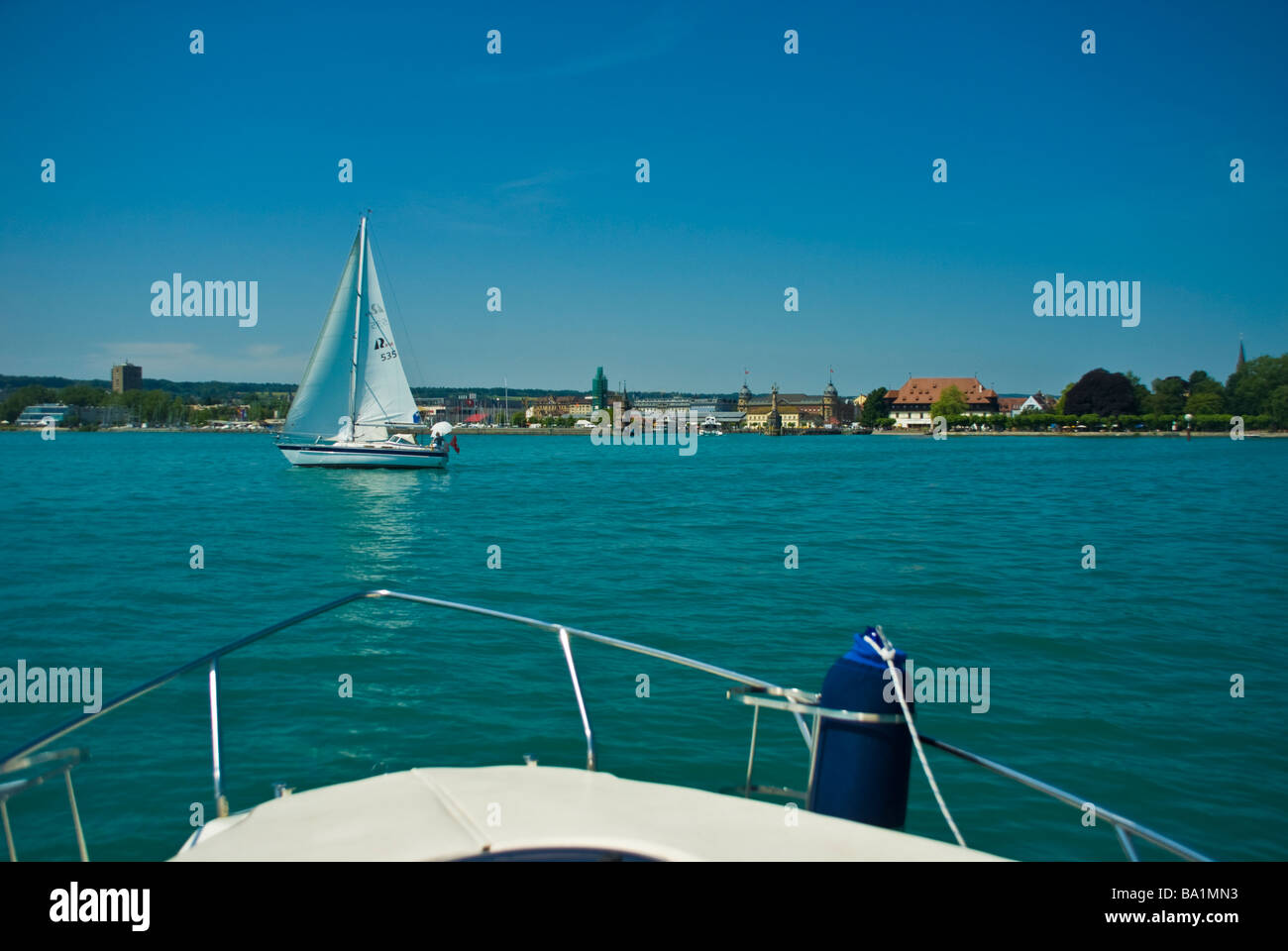 Bow of powerboat and sail yacht at harbor entrance Konstanz Lake Constance Germany | Boote vor dem Hafen von Konstanz Stock Photo