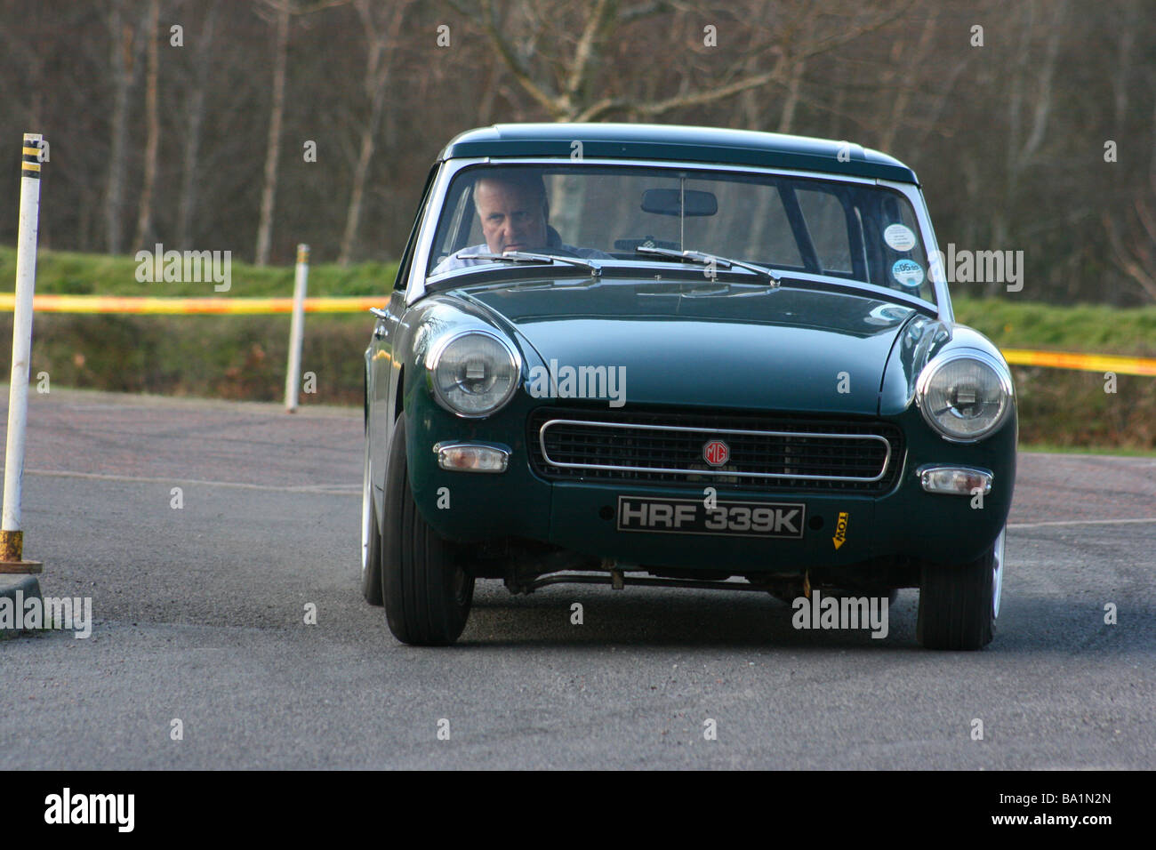 MG Midget cornering at speed during an autotest event in Delamont Country Park, County Down, Northern Ireland Stock Photo