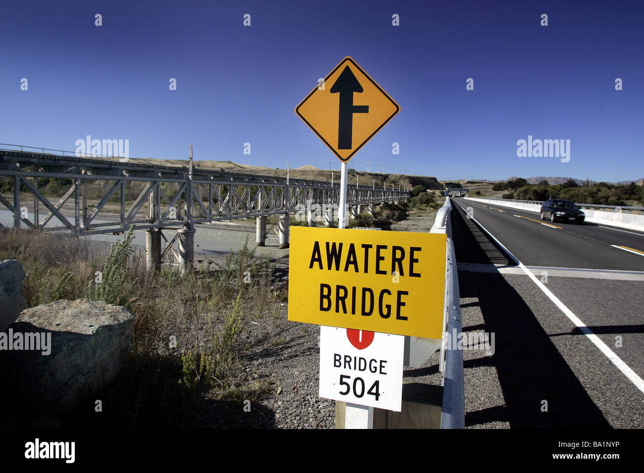 road sign at the new Awatere Bridge with the old road rail bridge in the background, Marlborough, New Zealand Stock Photo