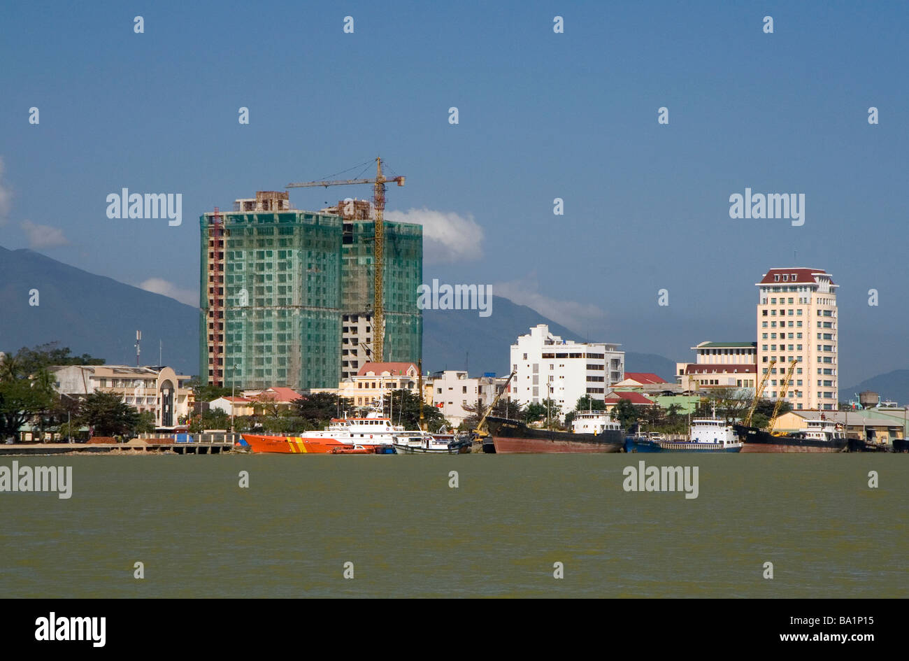 High rise buildings along the Han River in the port city of Da Nang Vietnam Stock Photo
