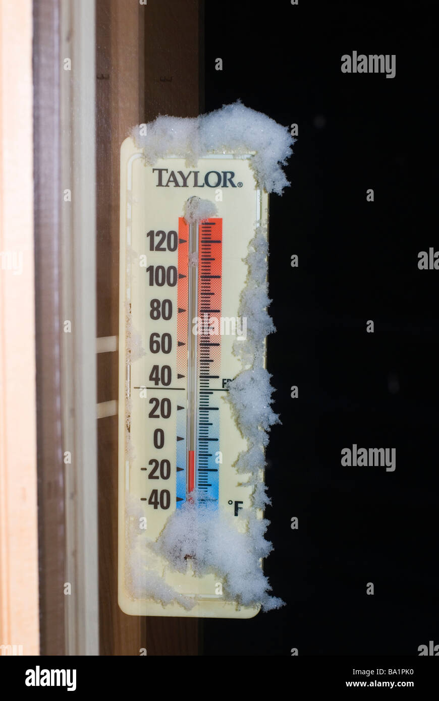 Thermometer registers cold night in Colorado foothills outside Boulder Minus eight degrees or eight degrees below zero Stock Photo