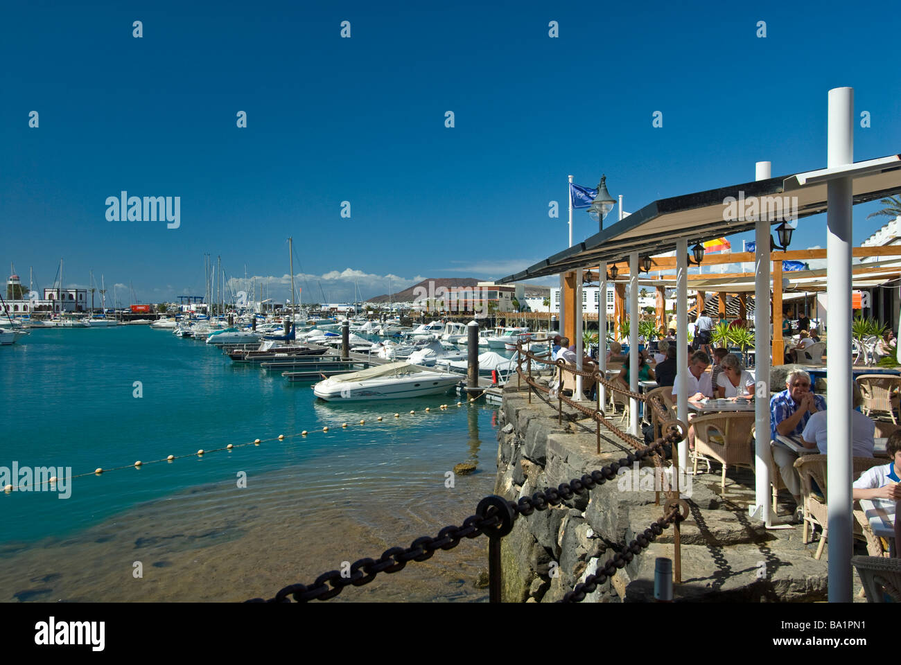 MARINA RUBICON Waterside restaurant showing lava flow with people