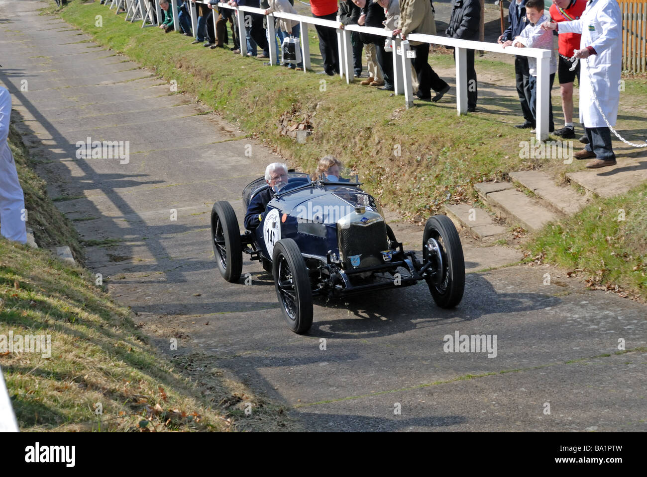 VM 4913 a 1928 Riley Brooklands Julian Booty ascending at speed on the Brooklands Museum Test Hill Challenge celebrating the Stock Photo
