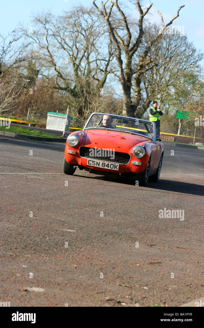 MG Midget at speed during an autotest event in Delamont Country Park, County Down, Northern Ireland Stock Photo