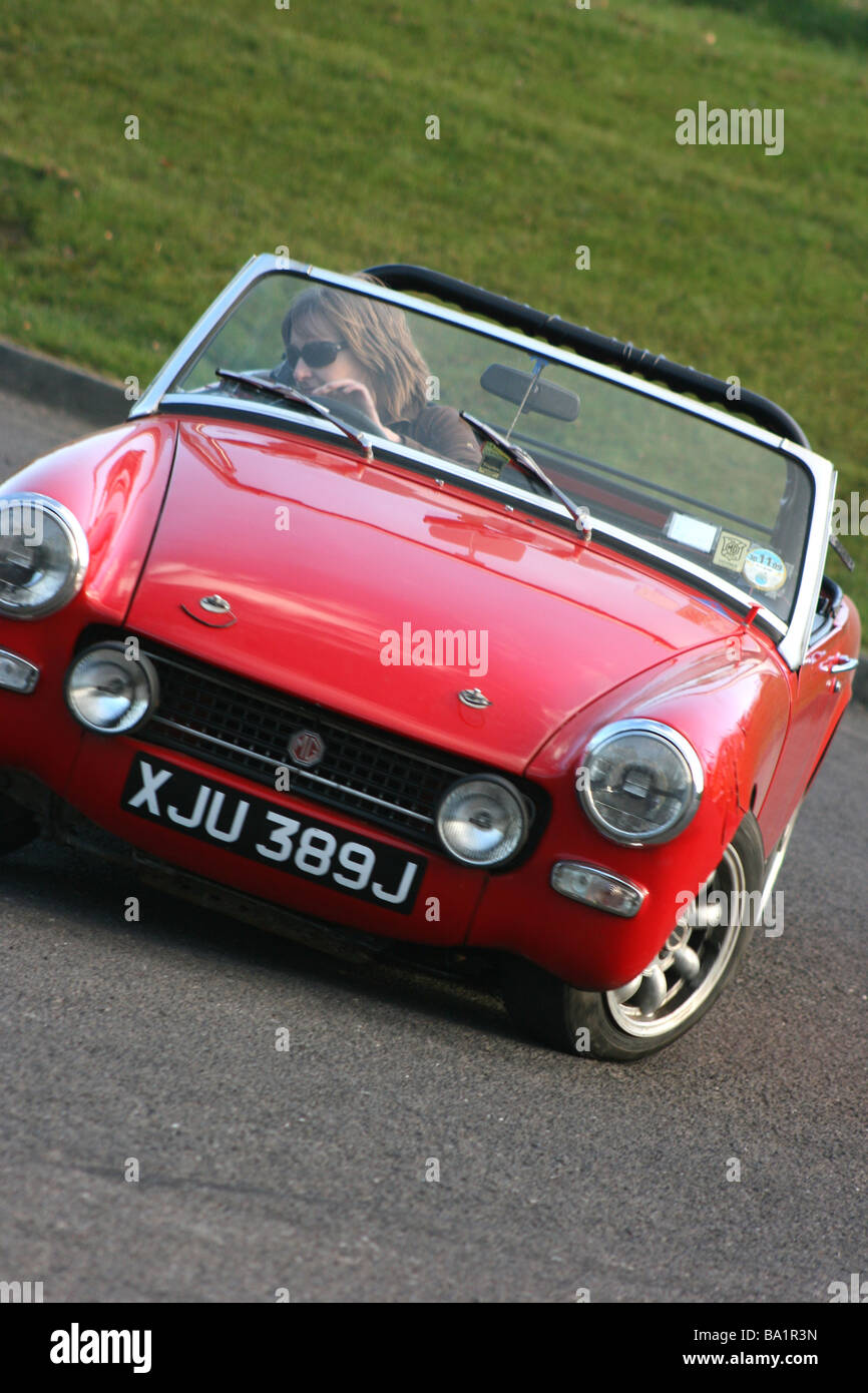 MG Midget cornering at speed during an autotest event in Delamont Country Park, County Down, Northern Ireland Stock Photo