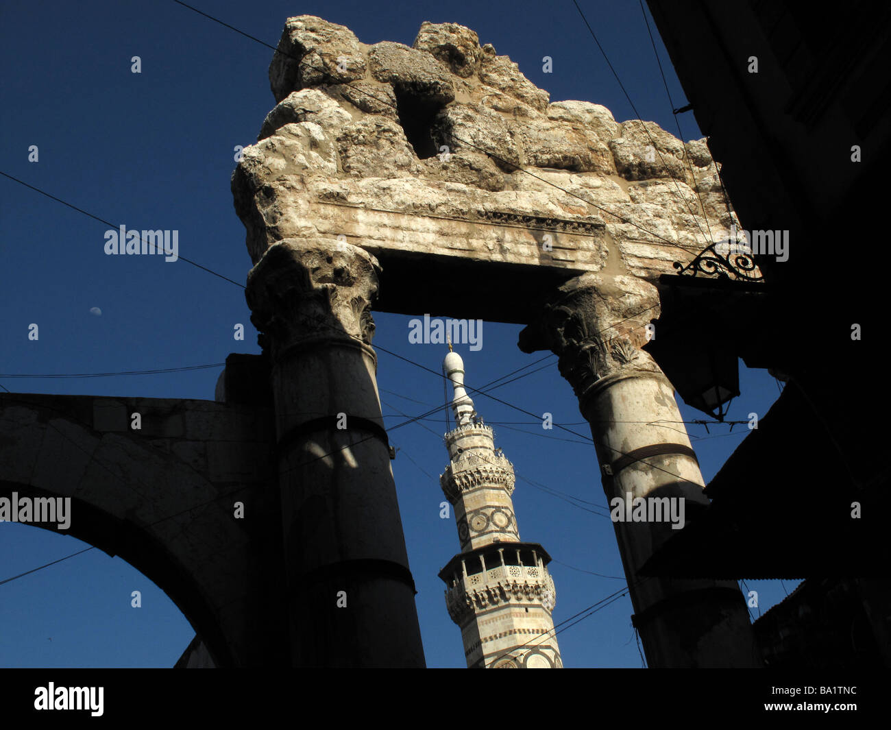 Great Umayyad or Omayyad Mosque minaret and Roman Temple of Jupiter Damascus SYRIA Stock Photo