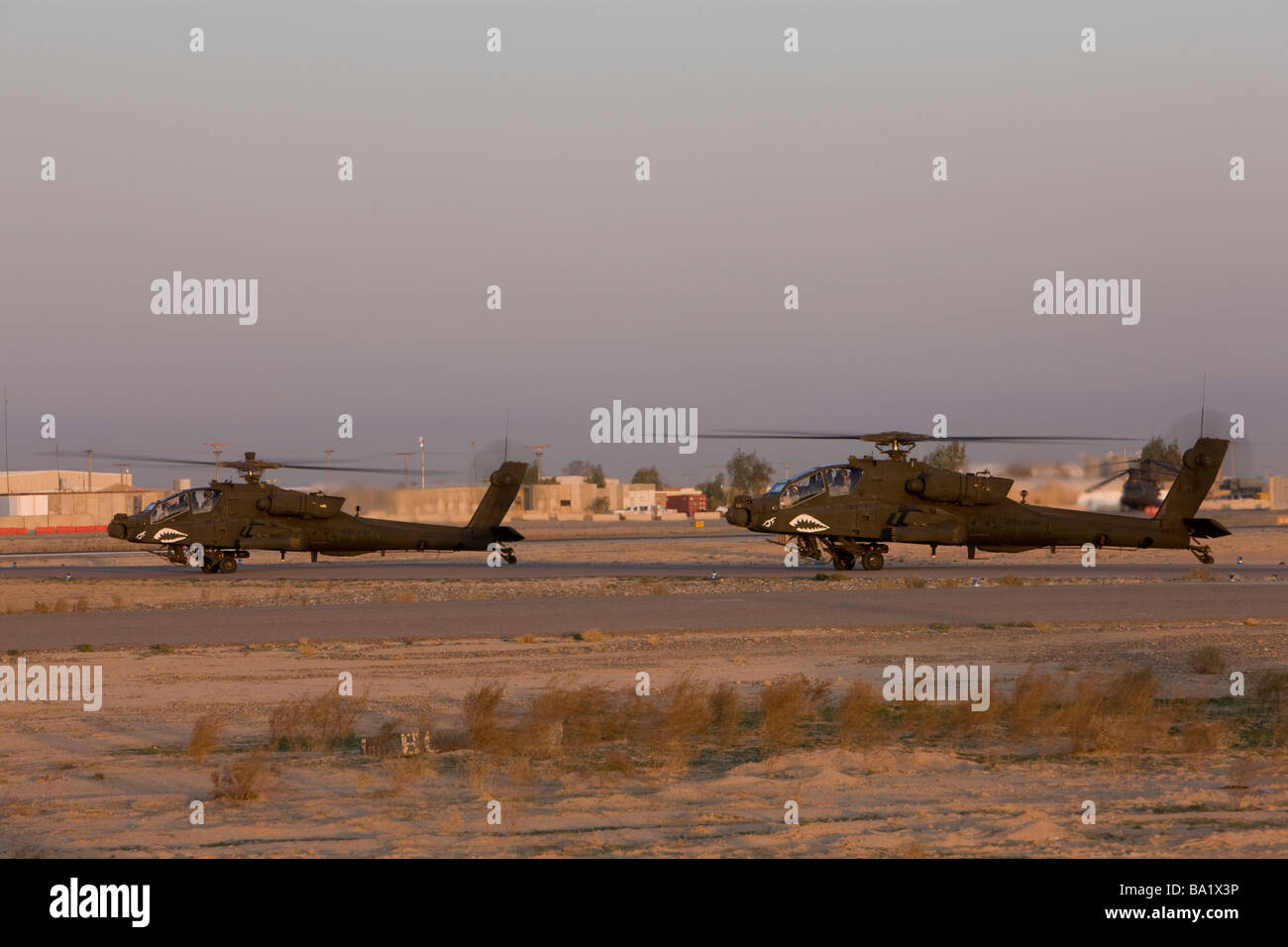 Tikrit, Iraq - A pair of AH-64 Apache helicopters prepare for takeoff. Stock Photo