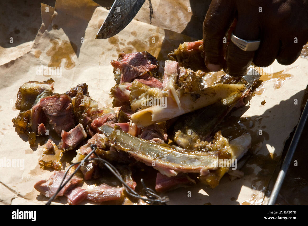 Senegalese Man Selling Roast Mutton in Senegal West Africa Stock Photo