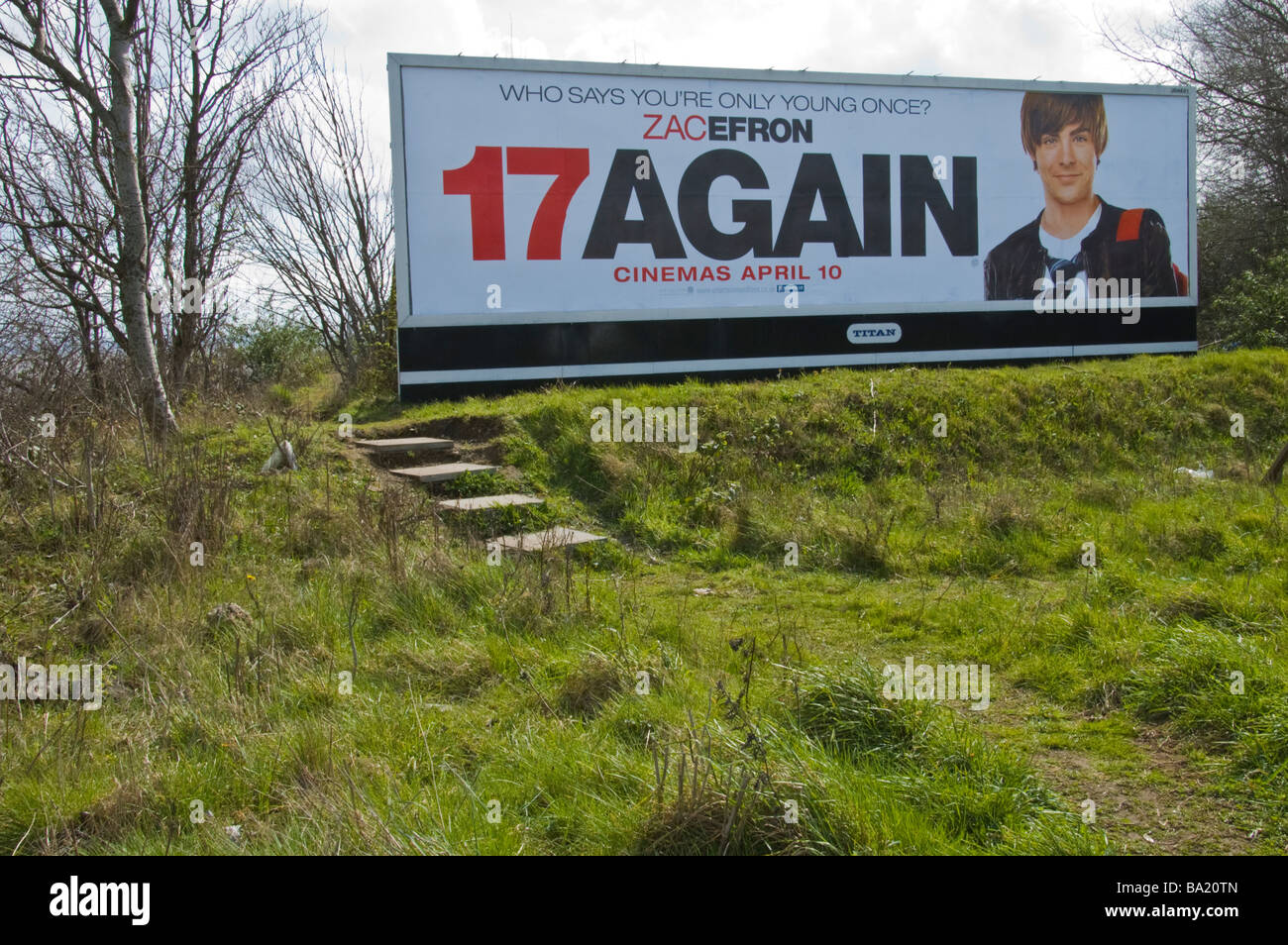 Titan advertising billboard for film 17AGAIN with Zac Efron on waste ground in Cardiff South Wales UK Stock Photo