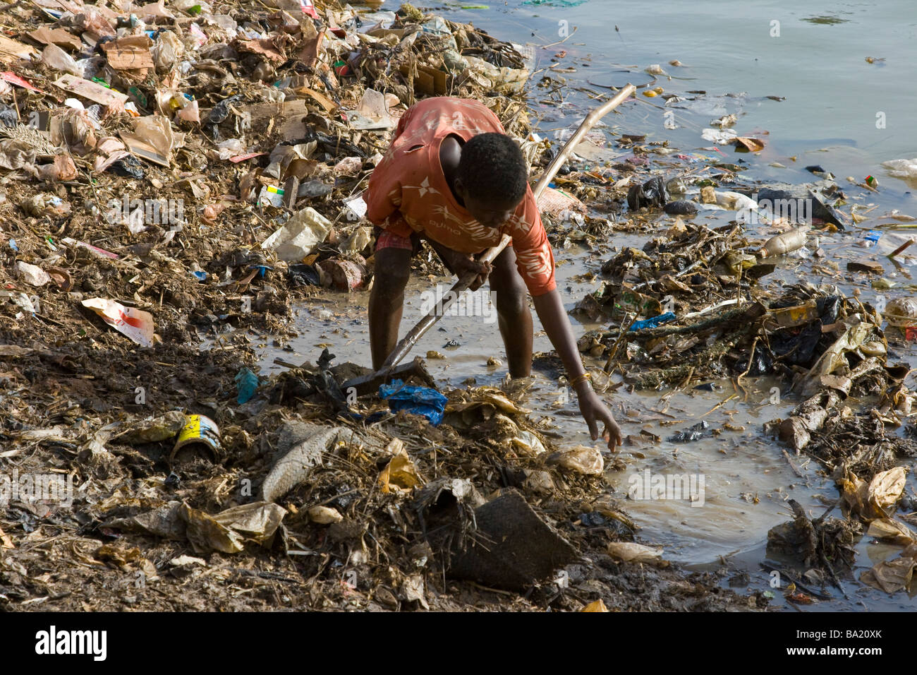 Boy Picking through Garbage at the Port in Mopti Mali Stock Photo Alamy