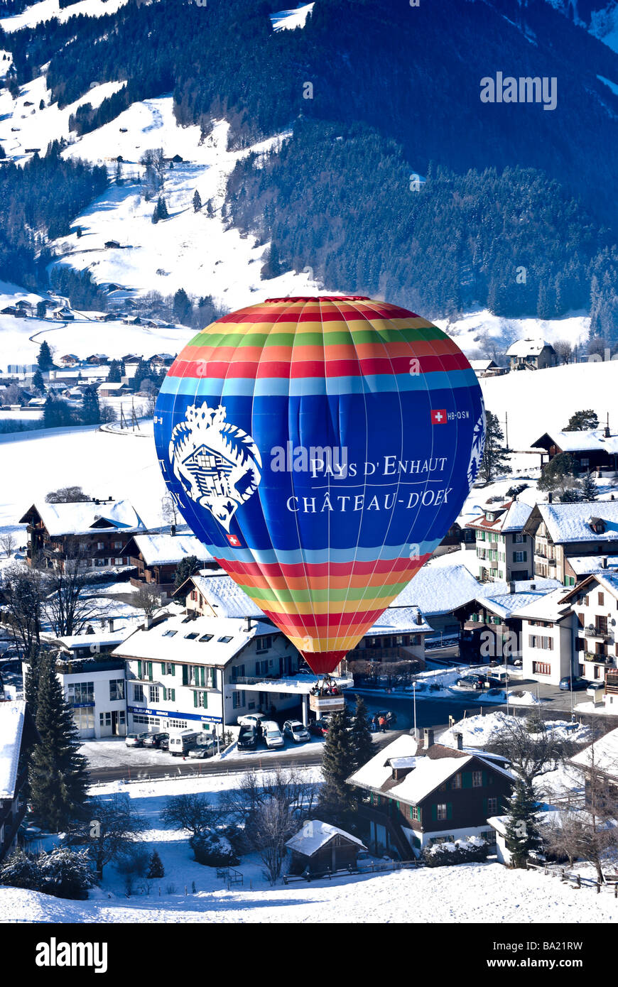Chateau d'Oex balloon floats above the village at the 2009 International Hot Air Balloon festival, Switzerland. Charles Lupica Stock Photo