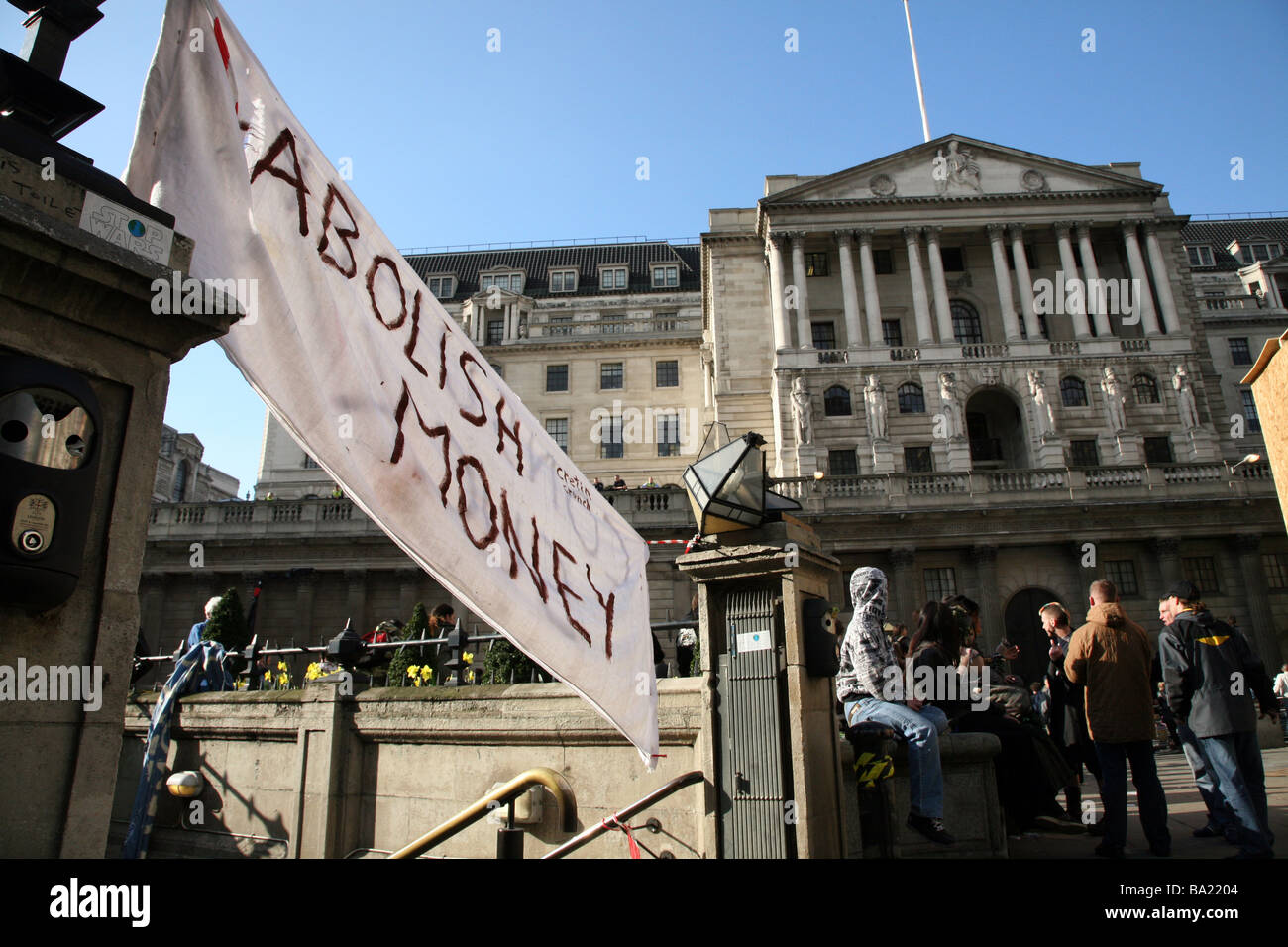 A banner outside the Bank of England at the G20 protests in London Stock Photo