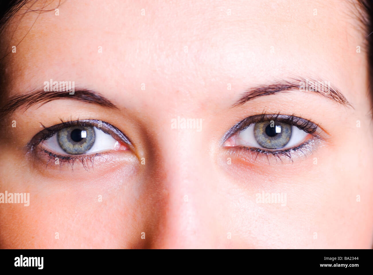 close up of a young woman with blue eyes looking at the camera Stock ...