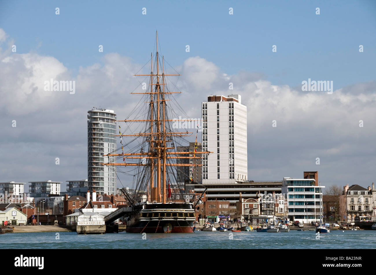 Steam ship, H M S Warrior and tower blocks Stock Photo
