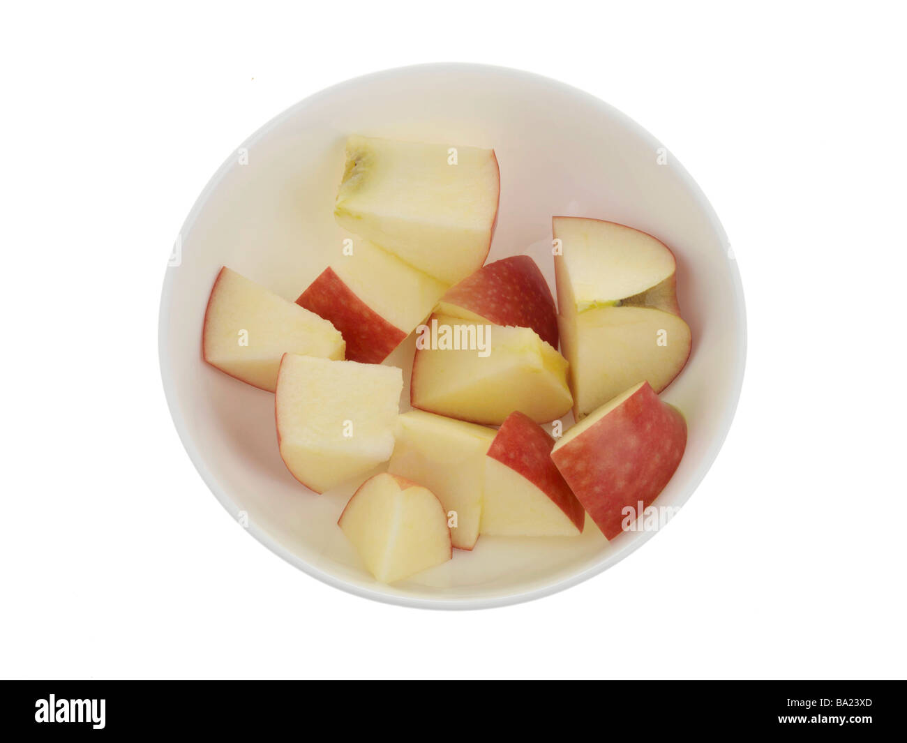 Fresh Ripe Healthy Chopped Red Apple in a Bowl Isolated Against A White Background With No People And A Clipping Path Stock Photo