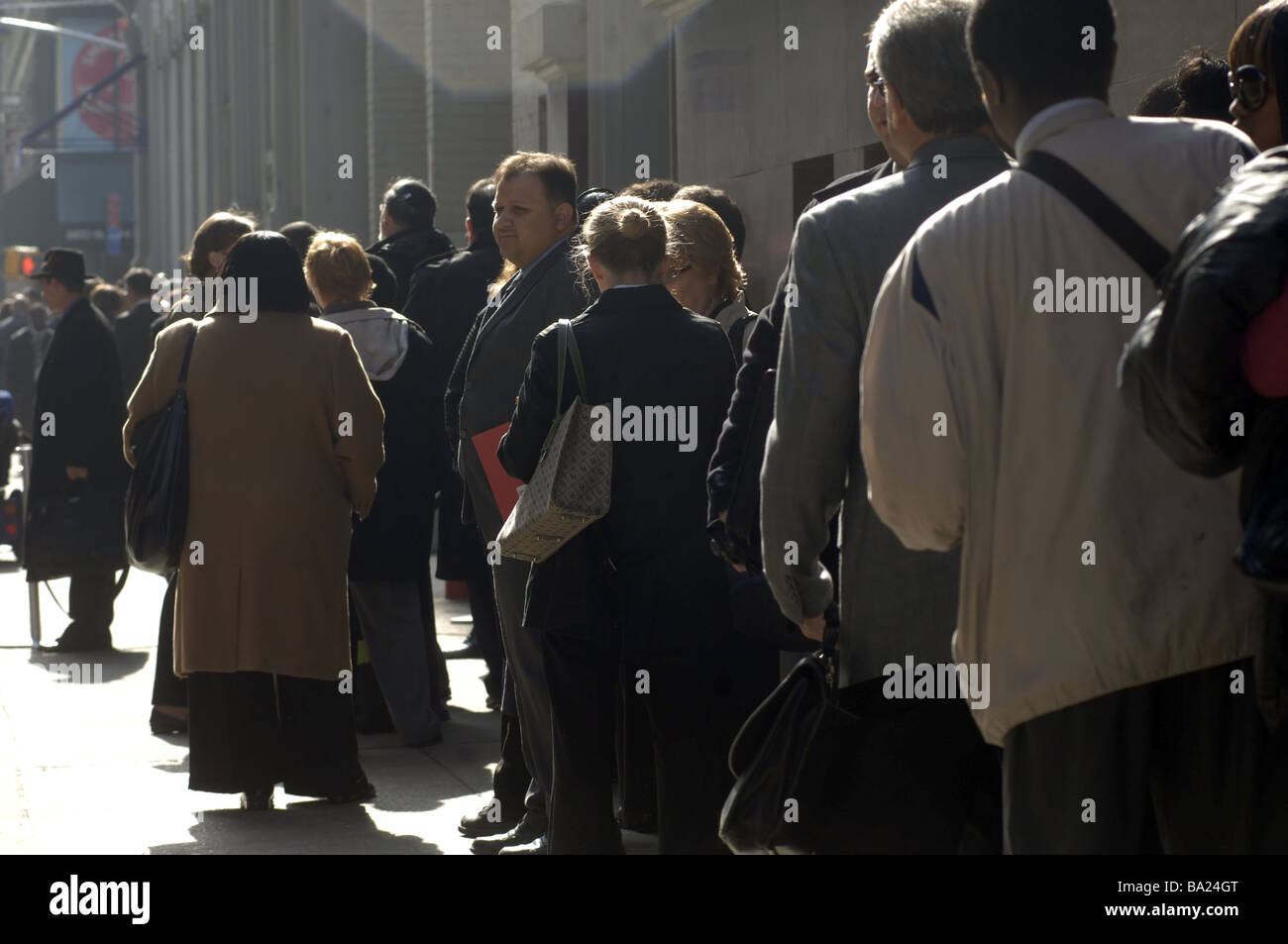 Job seekers line up in New York on Thursday April 2 2009 for a job fair sponsored by the website CareerBuilder Stock Photo