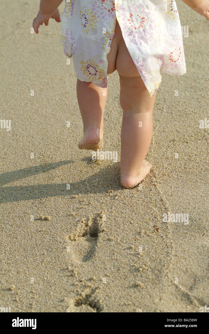 Girls backopinion detail fanny bare beach runs people child toddler 1