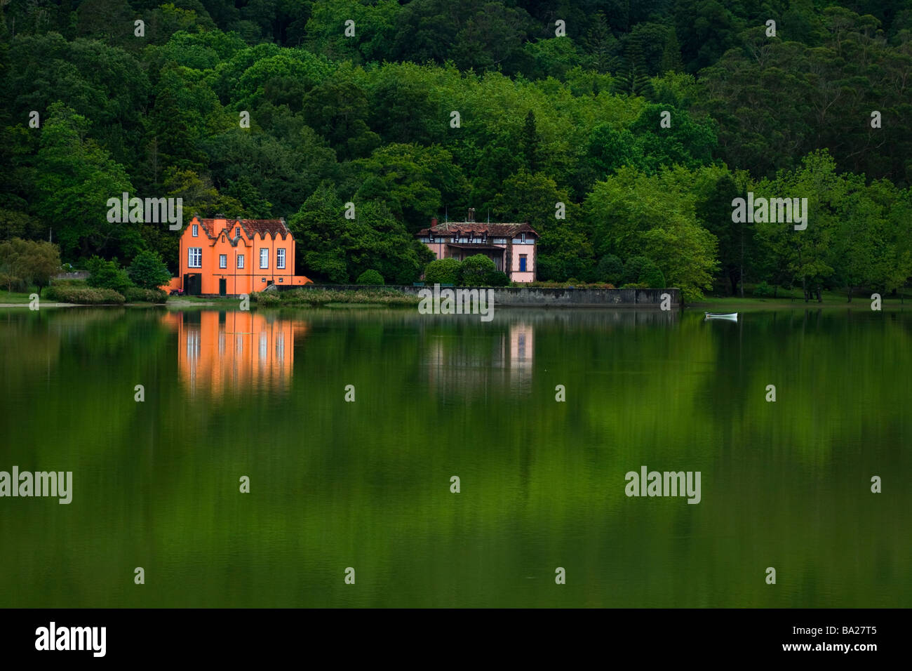 Country houses near Furnas Lagoon with reflected forest on lagoon,Sao