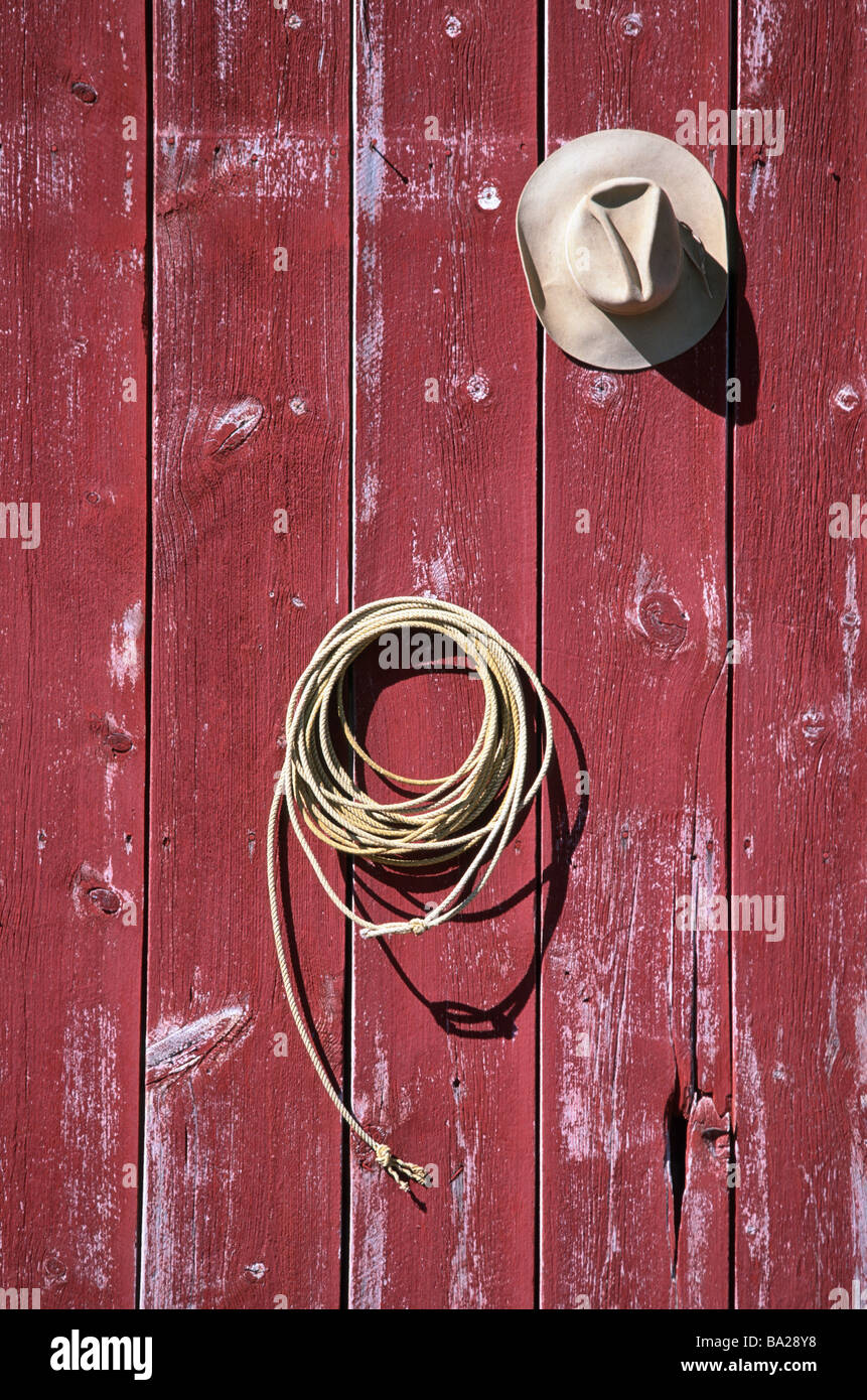 Wood-wall hooks cowboy-hat lasso barn hung up wood-boards red weathered ...