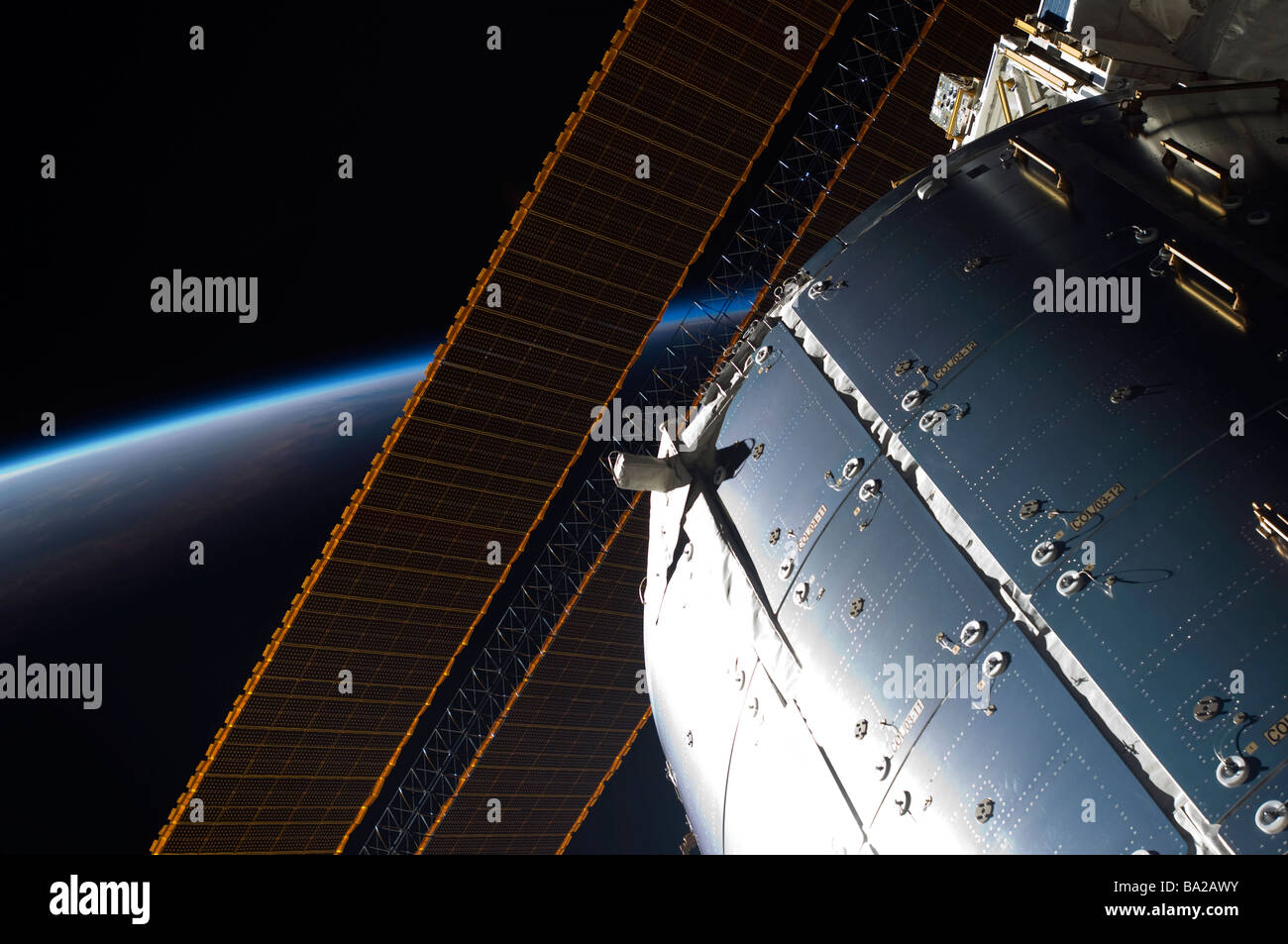A portion of the International Space Station's Columbus laboratory and solar array panels. Stock Photo