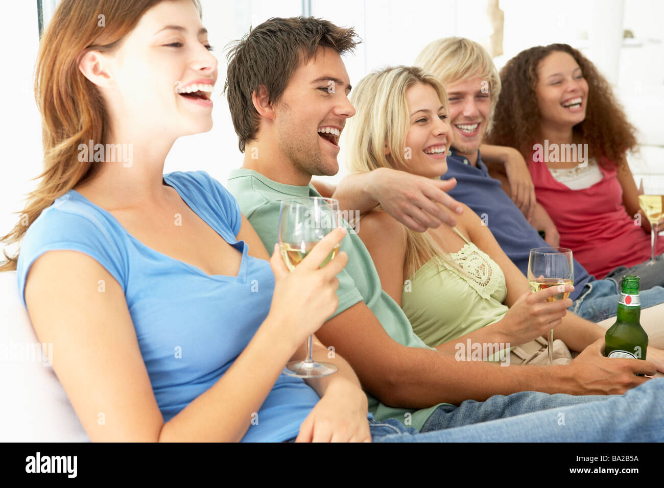 Friends watching television wine hi-res stock photography and images ...