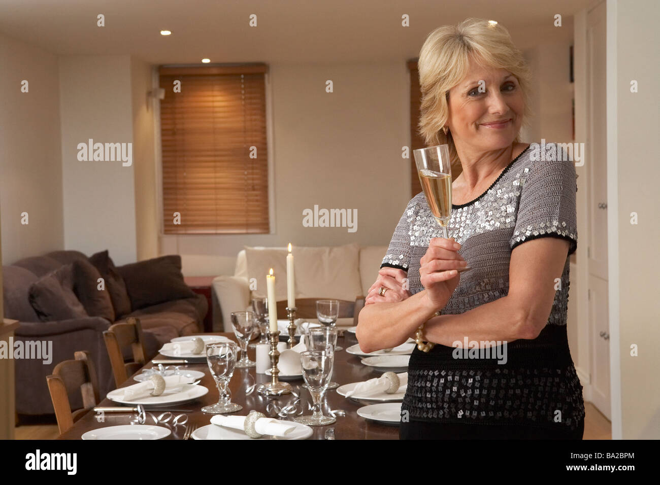 Woman Throwing A Dinner Party Stock Photo Alamy