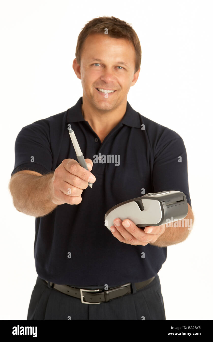 Courier Writing On An Electronic Clipboard, Smiling At The Camera Stock Photo