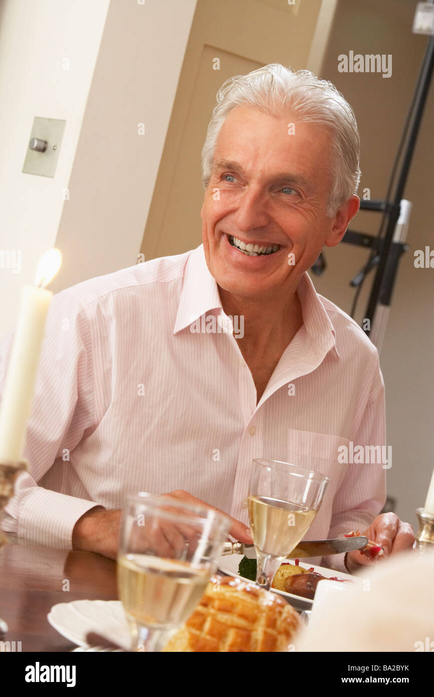 Man Eating Dinner At Home Stock Photo