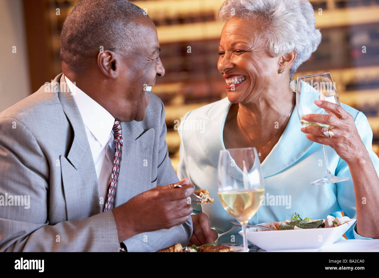 Senior Couple Having Dinner Together At A Restaurant Stock Photo