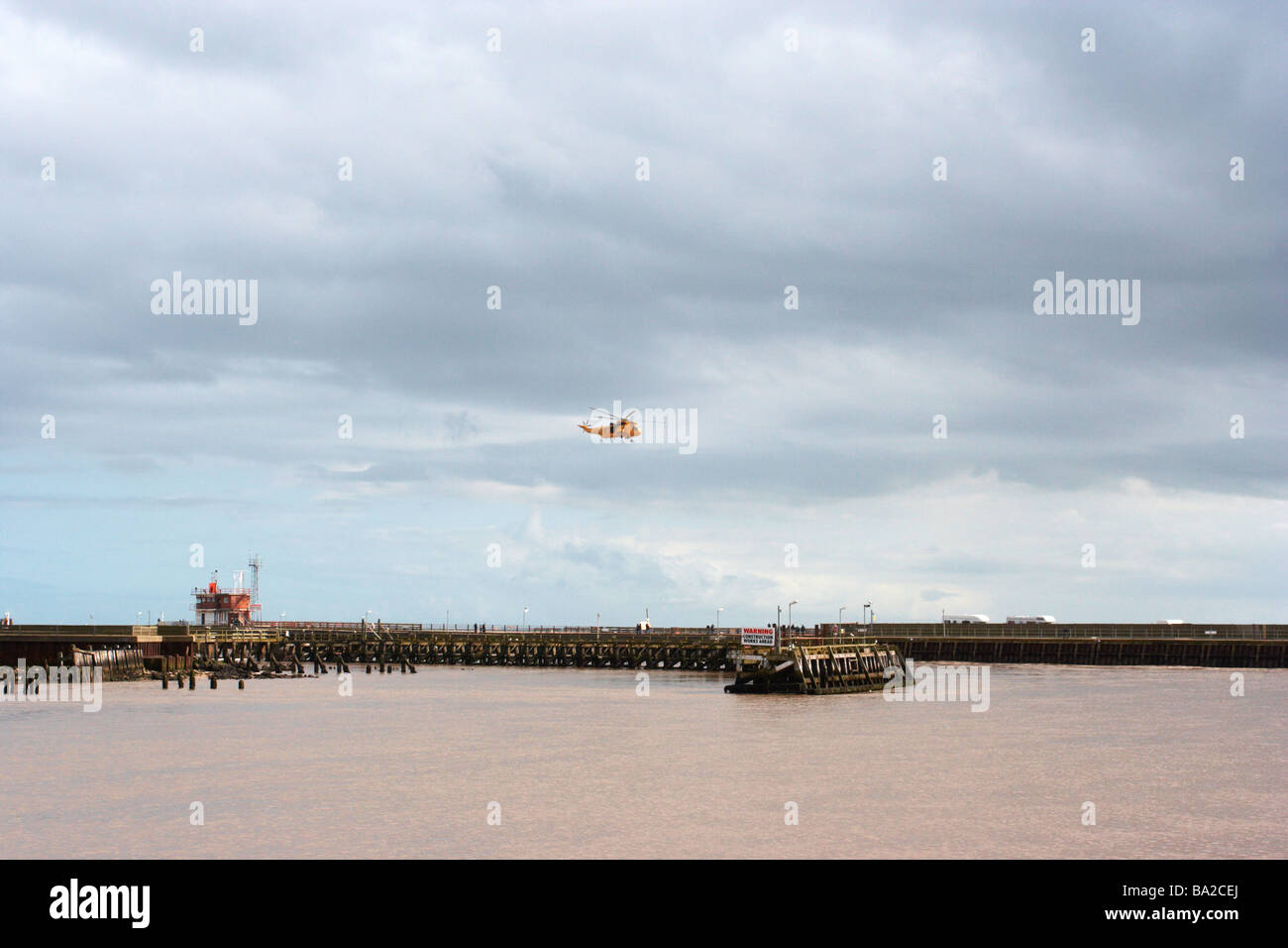 helicopter flying over harbour,great yarmouth harbour,norfolk Stock Photo