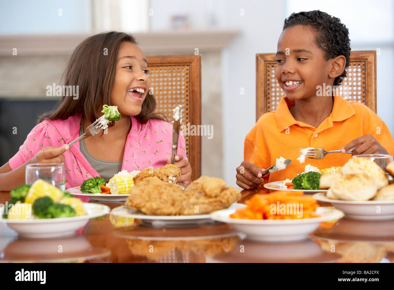Brother And Sister Having Lunch Together At Home Stock Photo