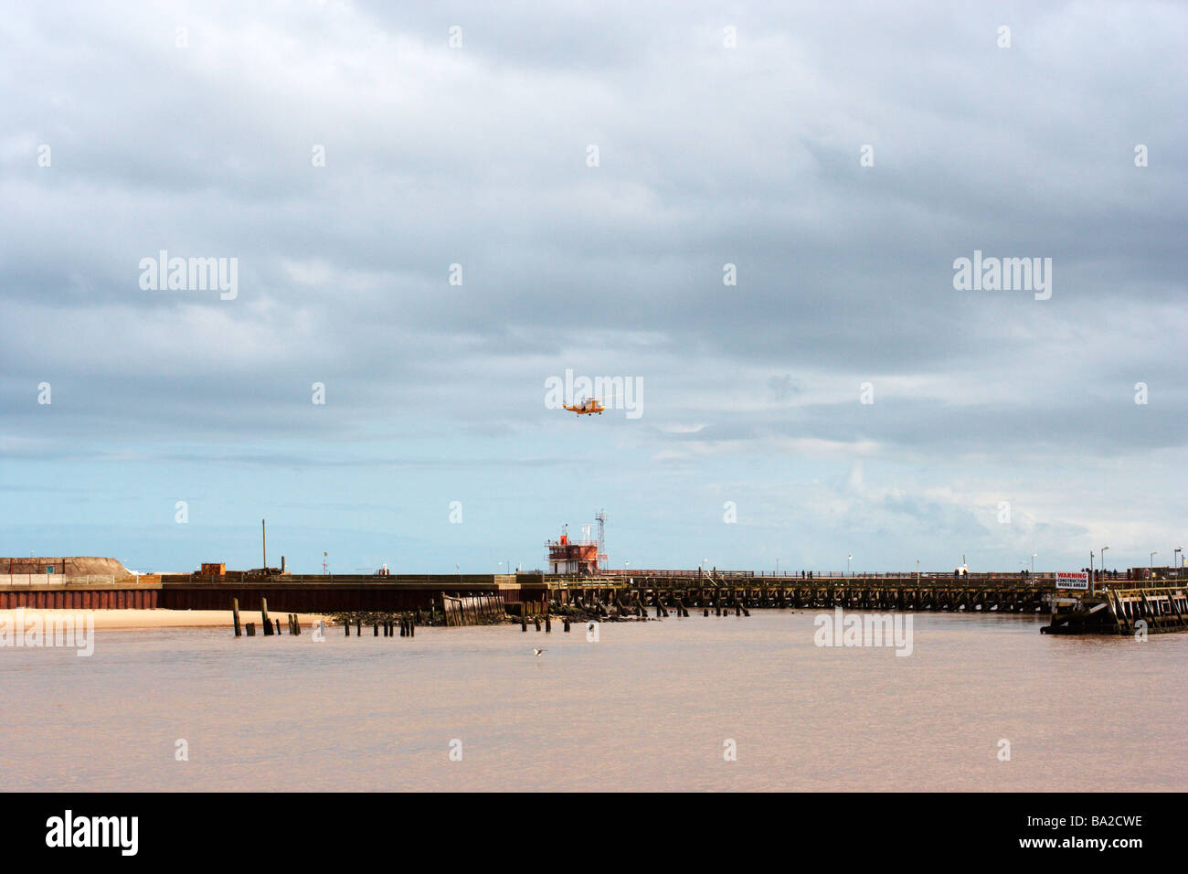 helicopter flying over harbour,great yarmouth harbour,norfolk Stock Photo