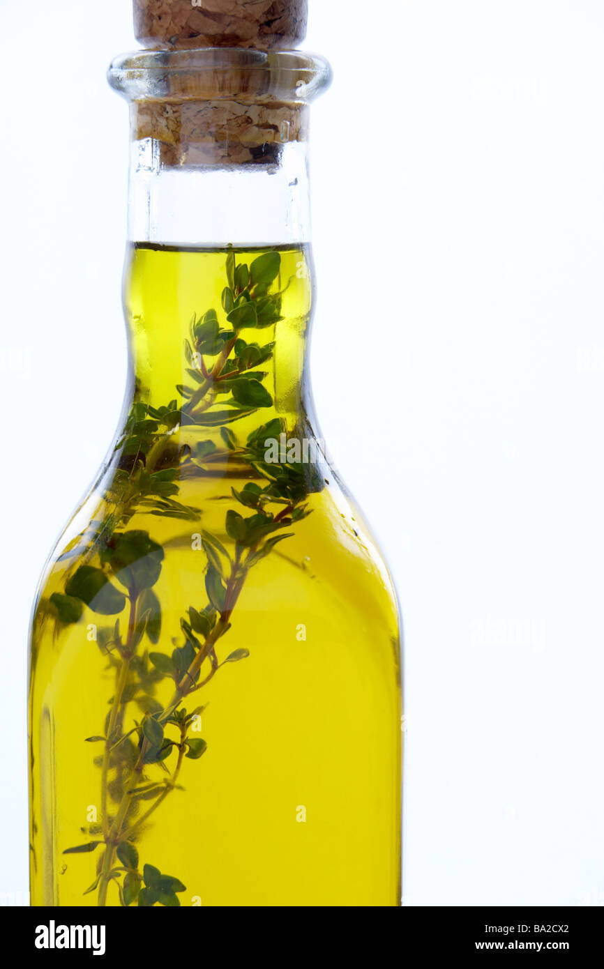 Bottle Of Olive Oil With Herbs Stock Photo - Alamy