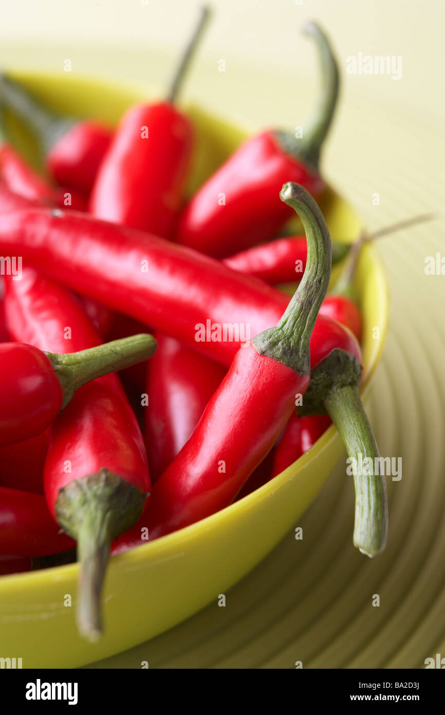 Red Chili Peppers In A Green Bowl Stock Photo