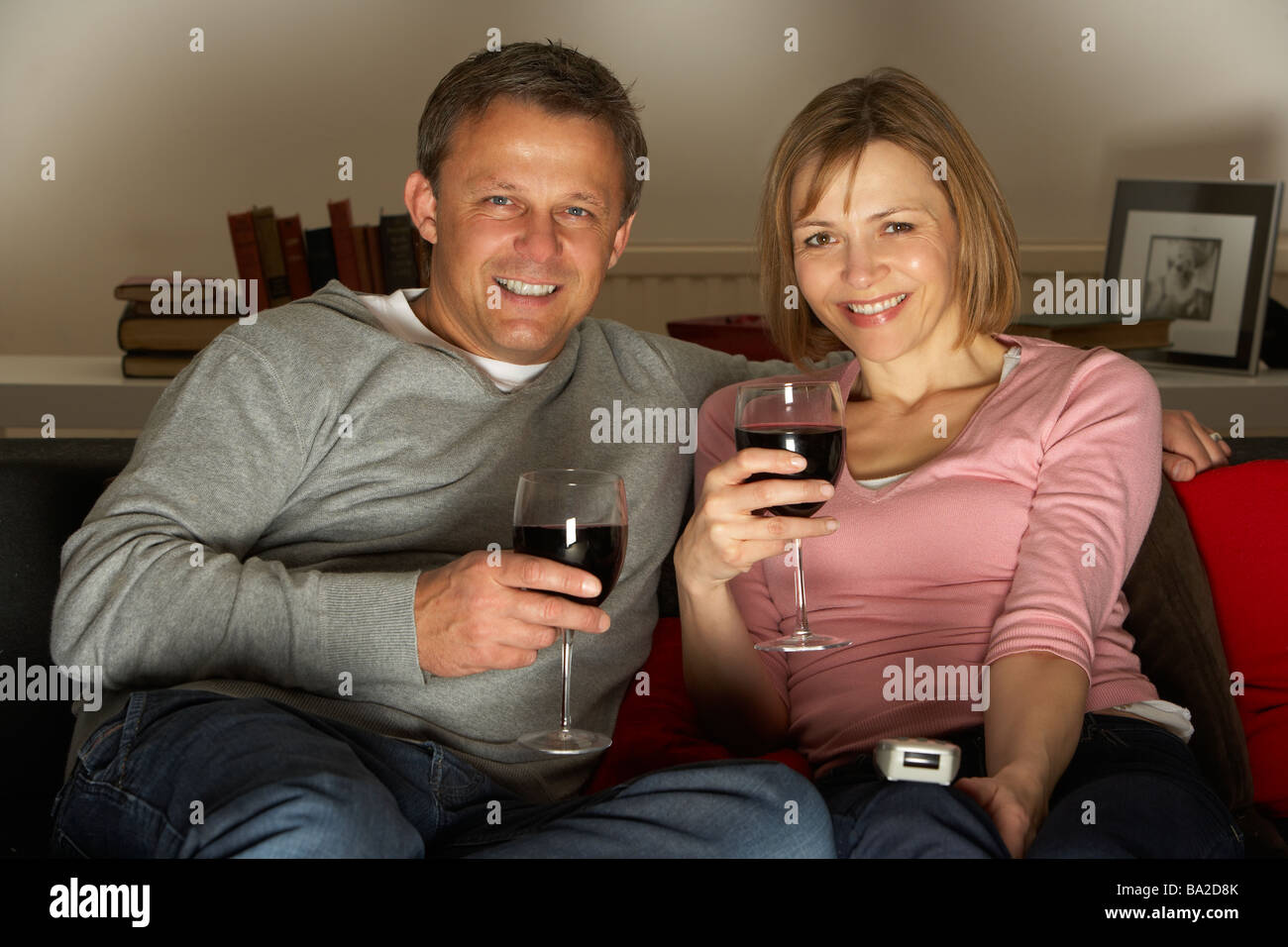 Couple Drinking Wine And Watching Television Stock Photo - Alamy