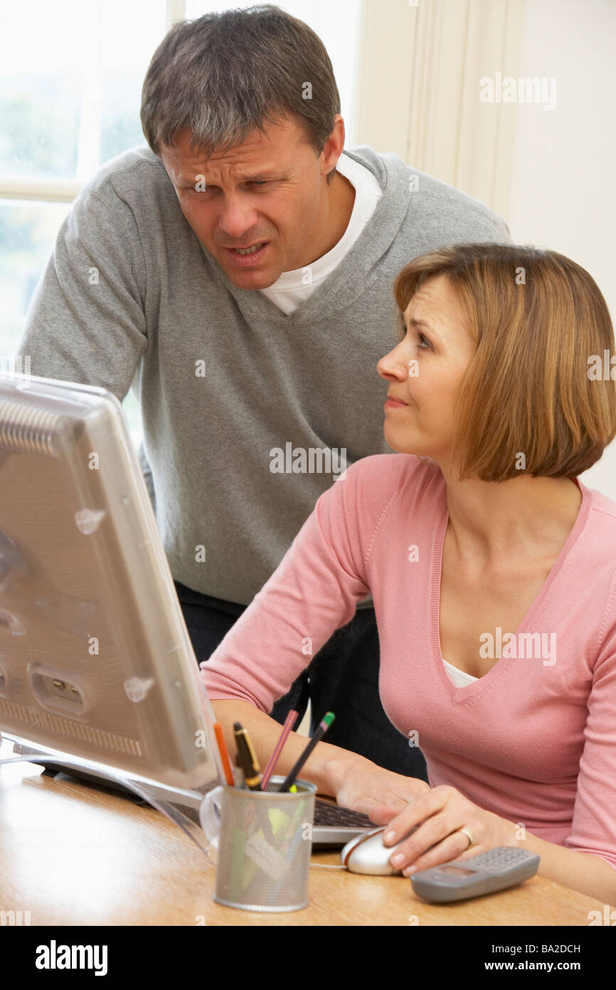 Couple Using Computer Stock Photo - Alamy